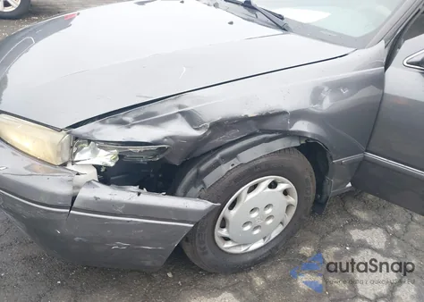 1999 Toyota Camry Le from USA, damaged, VIN 4T1BG22K4XU566174